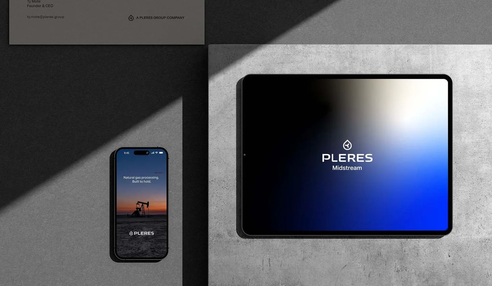 Phone showing a sunset pumpjack photo with the line Natural gas processing, built to hold, beside a tablet showing the white stacked logo on a blue-to-black gradient