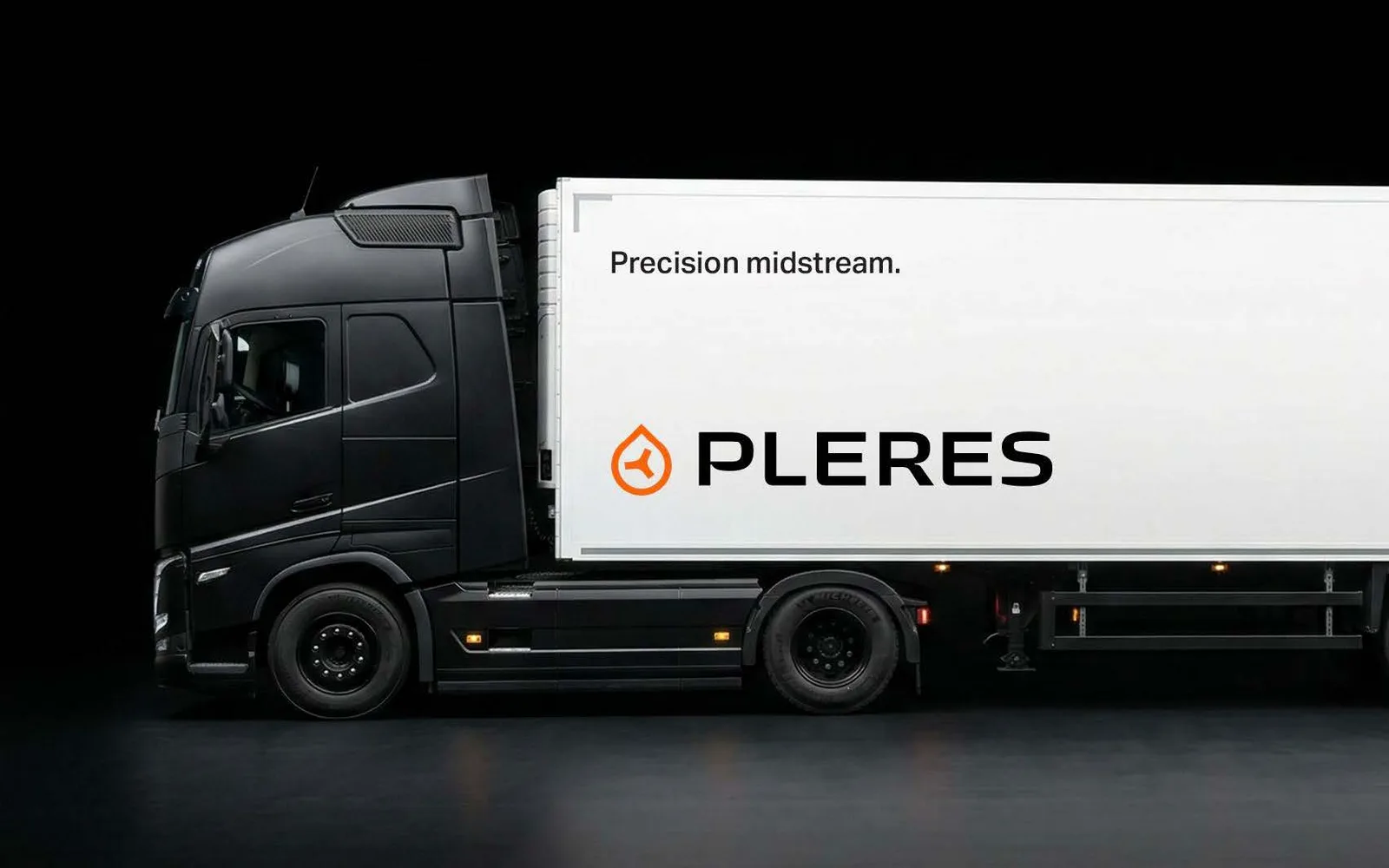 Black semi truck with a white trailer carrying the orange Pleres brand mark, the PLERES wordmark, and the line Precision midstream